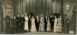 Unnamed play K, sixteen cast members draped door and screen, [no date].