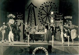 Unnamed play L, eleven cast members in fairground setting, [no date].