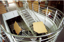 Tables on mezzanine stairs.