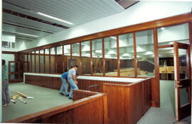 Workmen in former stage area.