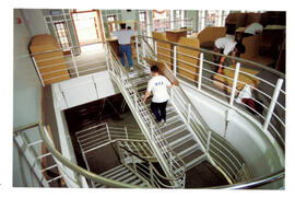Workmen on mezzanine stairs.