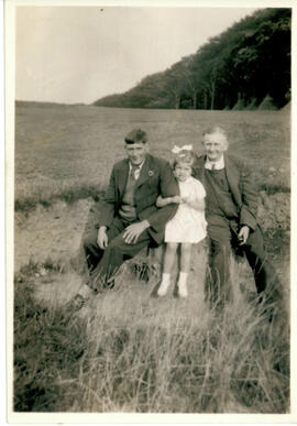 Family group of three.