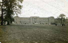 Education Block and lawn, with tree and band in background.