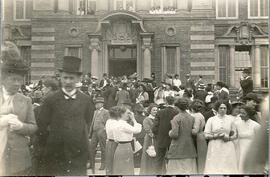Group, including man with top hat.
