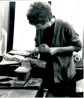 Carving with mallet.