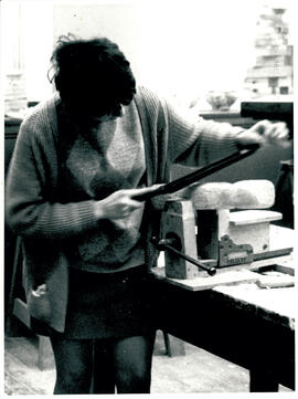 Using file on sculpture.