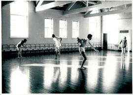 Five figures in movement.