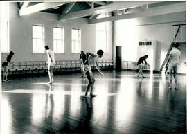 Six figures in movement.