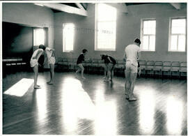 Seven figures in movement.