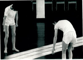 Two male students in movement.