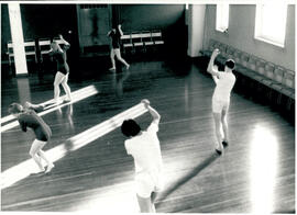 Five figures with arms high.